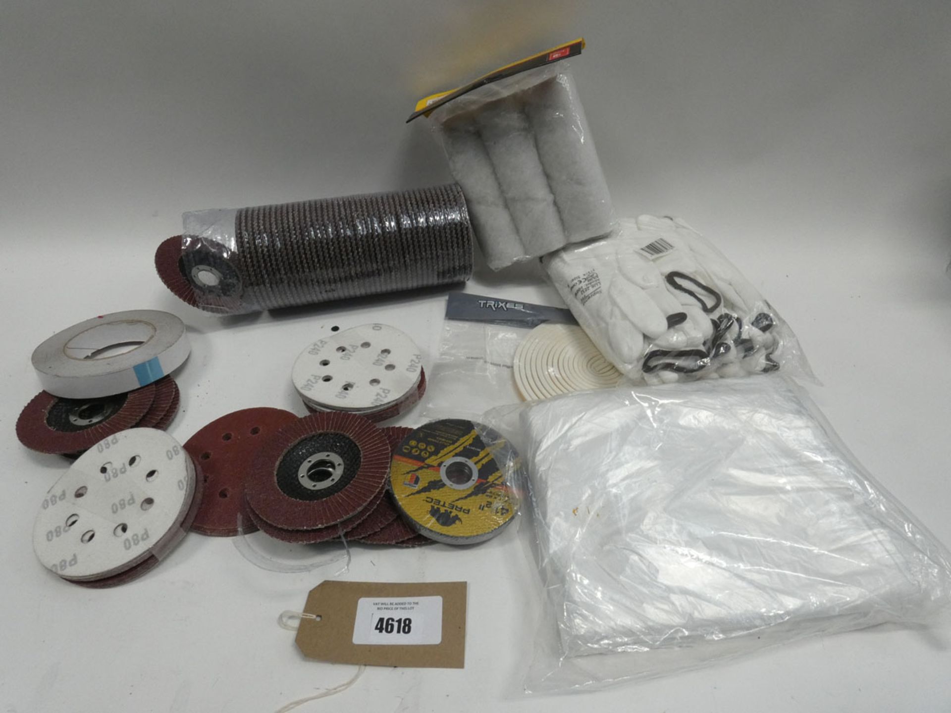 Bag containing: sanding pads, flapper wheels, work gloves, paint rollers, dust sheet, tape etc