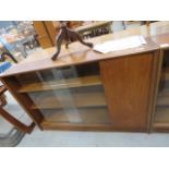 Teak bookcase with glazed sliding doors and cupboard to side Condition fair