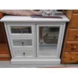 Cream painted cabinet with mirrored panels