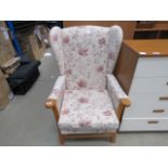 Floral patterned wing back armchair