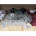 Quantity of brandy snifters, tumblers, wine glasses, coloured glass vases