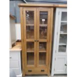 Glazed oak double door display cabinet with drawer under (111)