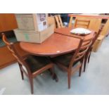 Oval G-plan extending dining table plus 4 chairs Top is scratched and possibly repainted, one