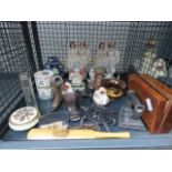 Cage containing flat iron, tortoise shaped trivet, Staffordshire flatback figures, various ornaments