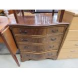 Reproduction mahogany serpentine fronted chest of 4 drawers