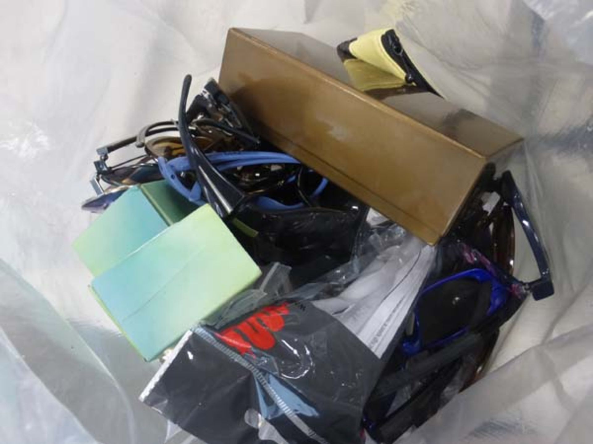 Bag containing various loose sunglasses cases and glasses, some damaged