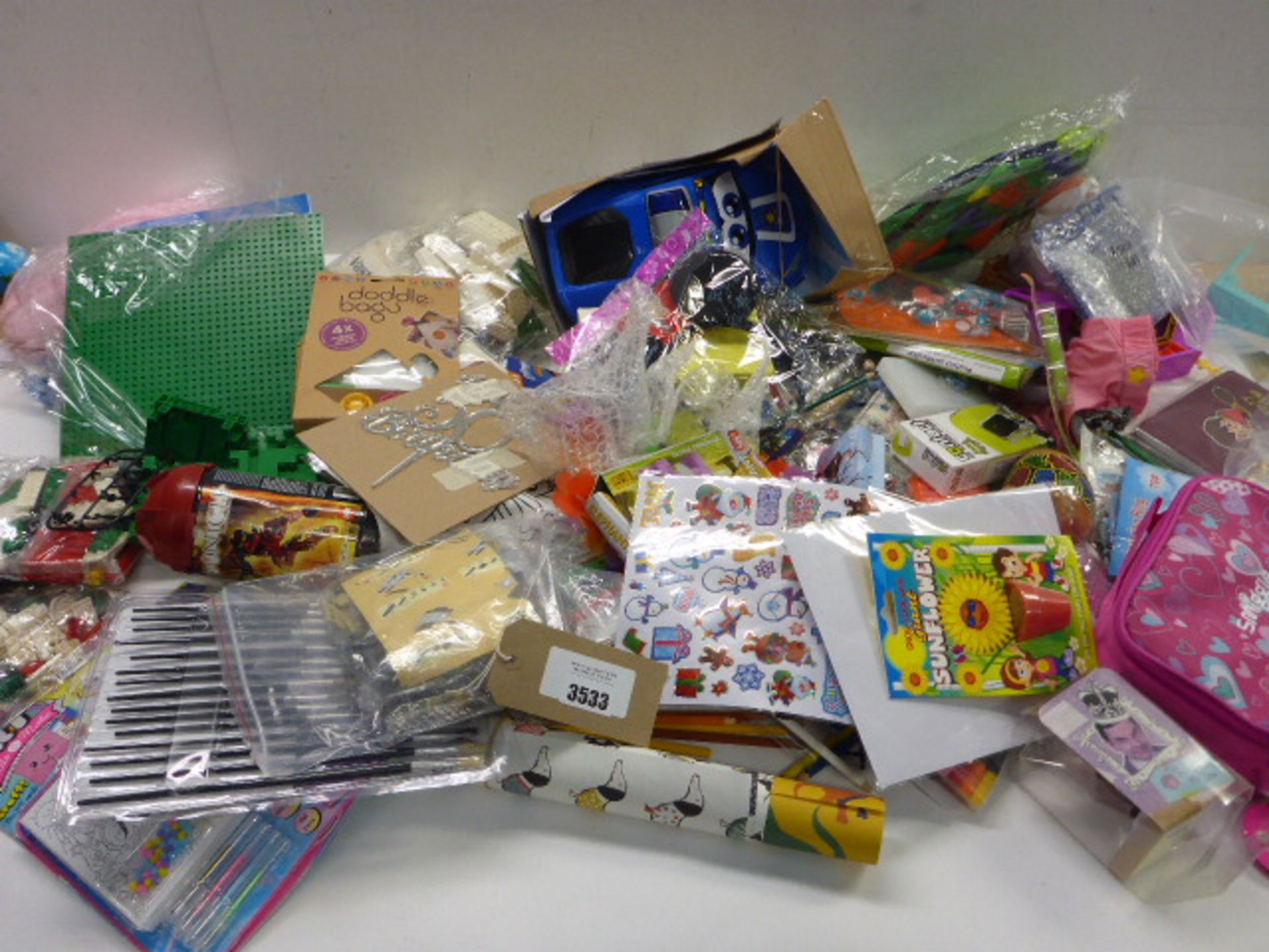 Large bag of novelty toys, Nerf bullets, activity magazine, building blocks, stickers, posters,