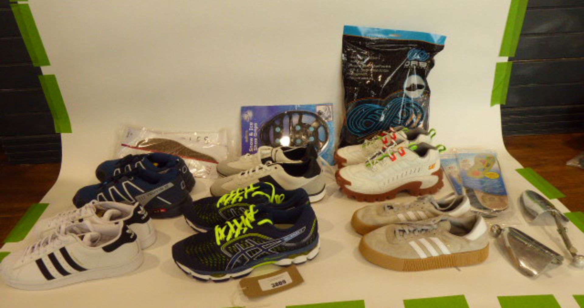 Bag of assorted trainers and footwear accessories