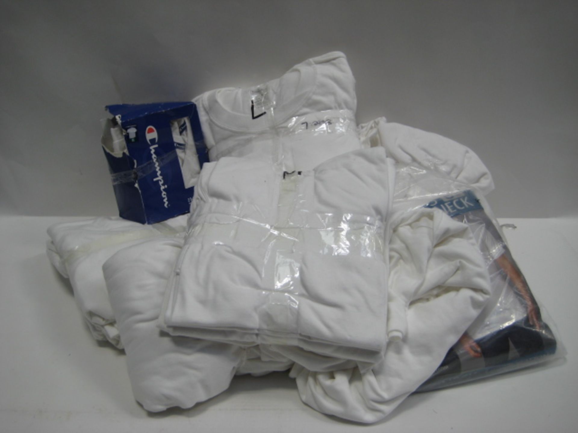 Bag containing gents white t-shirts by Champion and Kirkland. All in various sizes