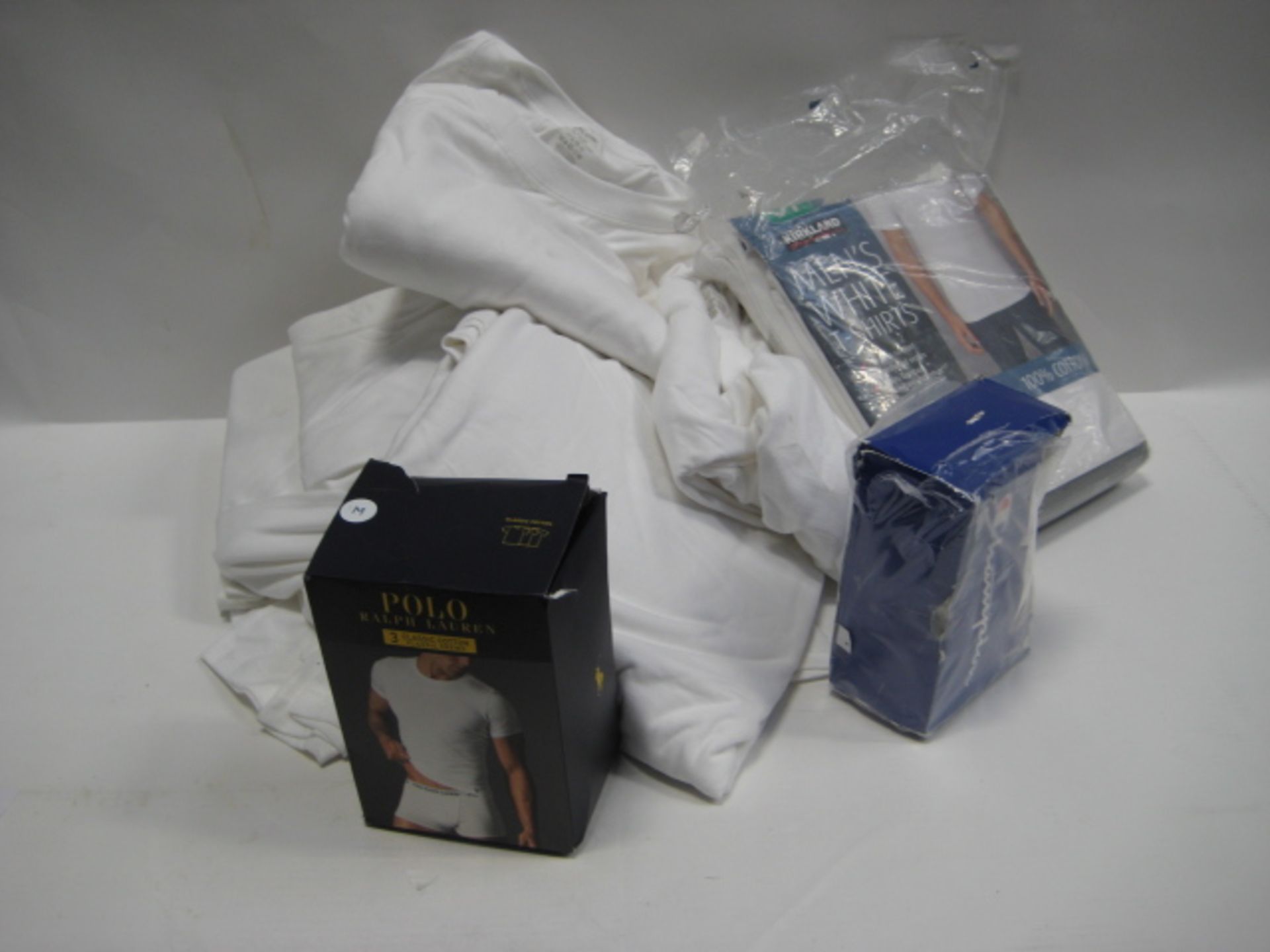 Bag containing gents white t-shirts by Kirkland, small box by Champion and a small box by Ralph