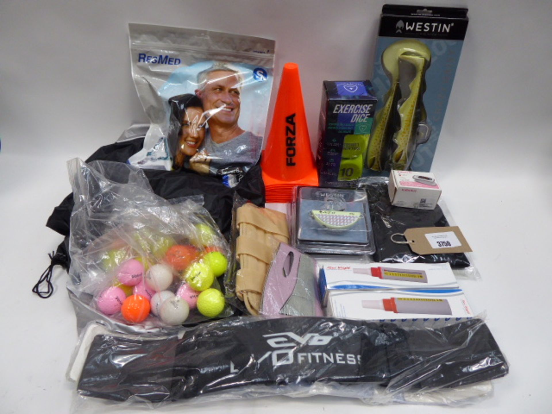 Bag containing Westin Crazy Daisy, golf balls, sports cones, pulse oximeter, peak flow meter, bike