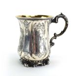 A Victorian silver and parcel gilt Christening mug in the Rococo manner, Edward,