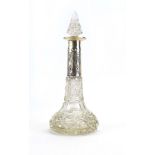 An early 20th century silver mounted cut glass dressing table bottle decorated in the Neo-Classical