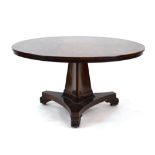 A 19th century mahogany and crossbanded circular dining table on a triangular form column,