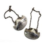 A pair of early 19th century Irish silver decanter labels of shell form, engraved for 'Madeira',