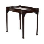 A Chippendale-style mahogany serpentine side table,