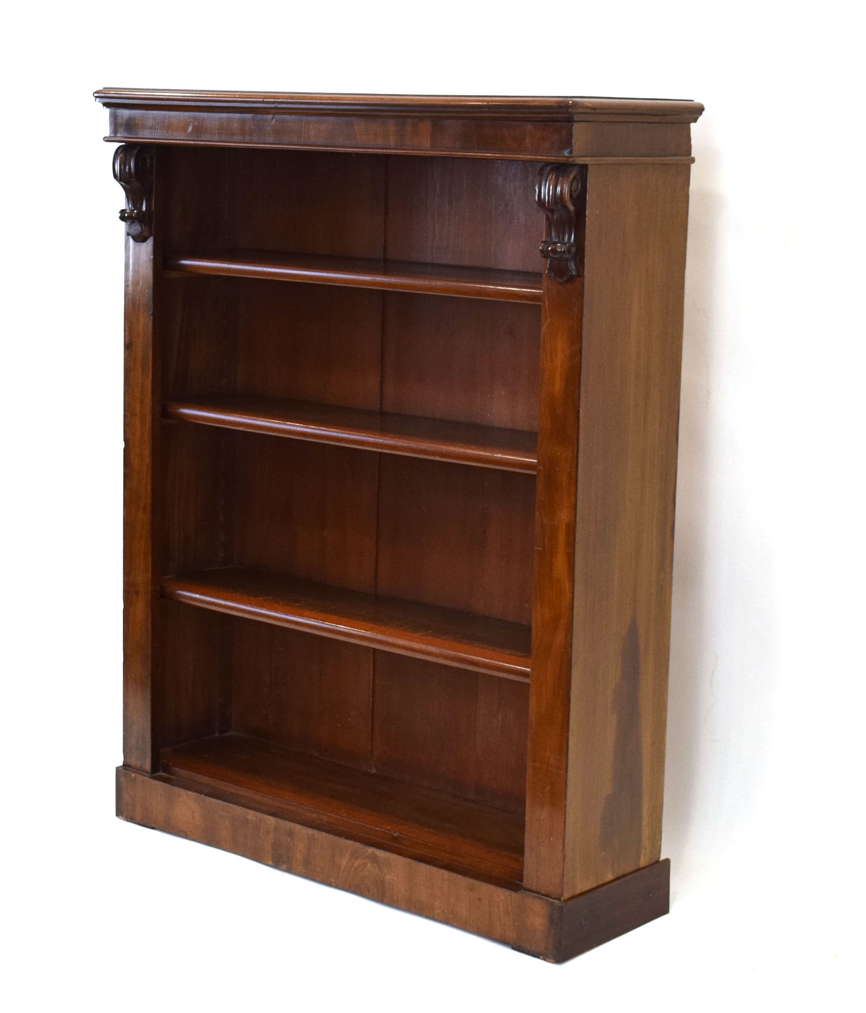 A Victorian mahogany open-fronted adjustable bookcase on a plinth base, w.