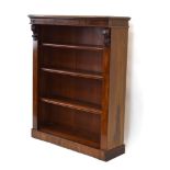 A Victorian mahogany open-fronted adjustable bookcase on a plinth base, w.