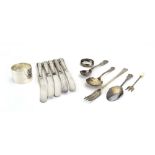 A mixed parcel of silver comprising two napkin rings, five silver handled butter knives,