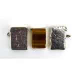 A late Victorian silver, florally engraved and tigers eye mounted vesta case of rectangular form,