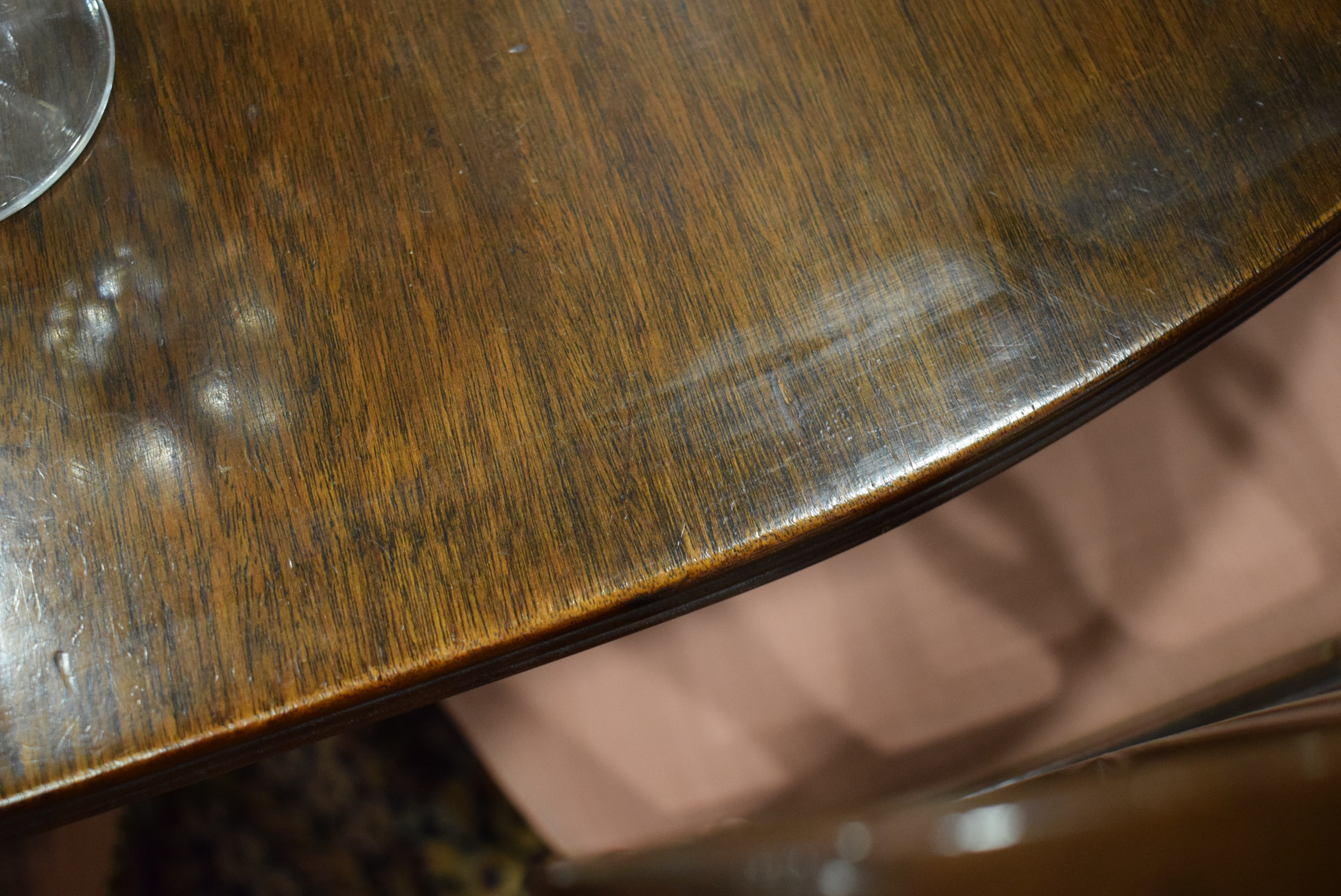 An early 20th century mahogany oval dining table on three columnar pedestals with reeded legs and - Image 9 of 12