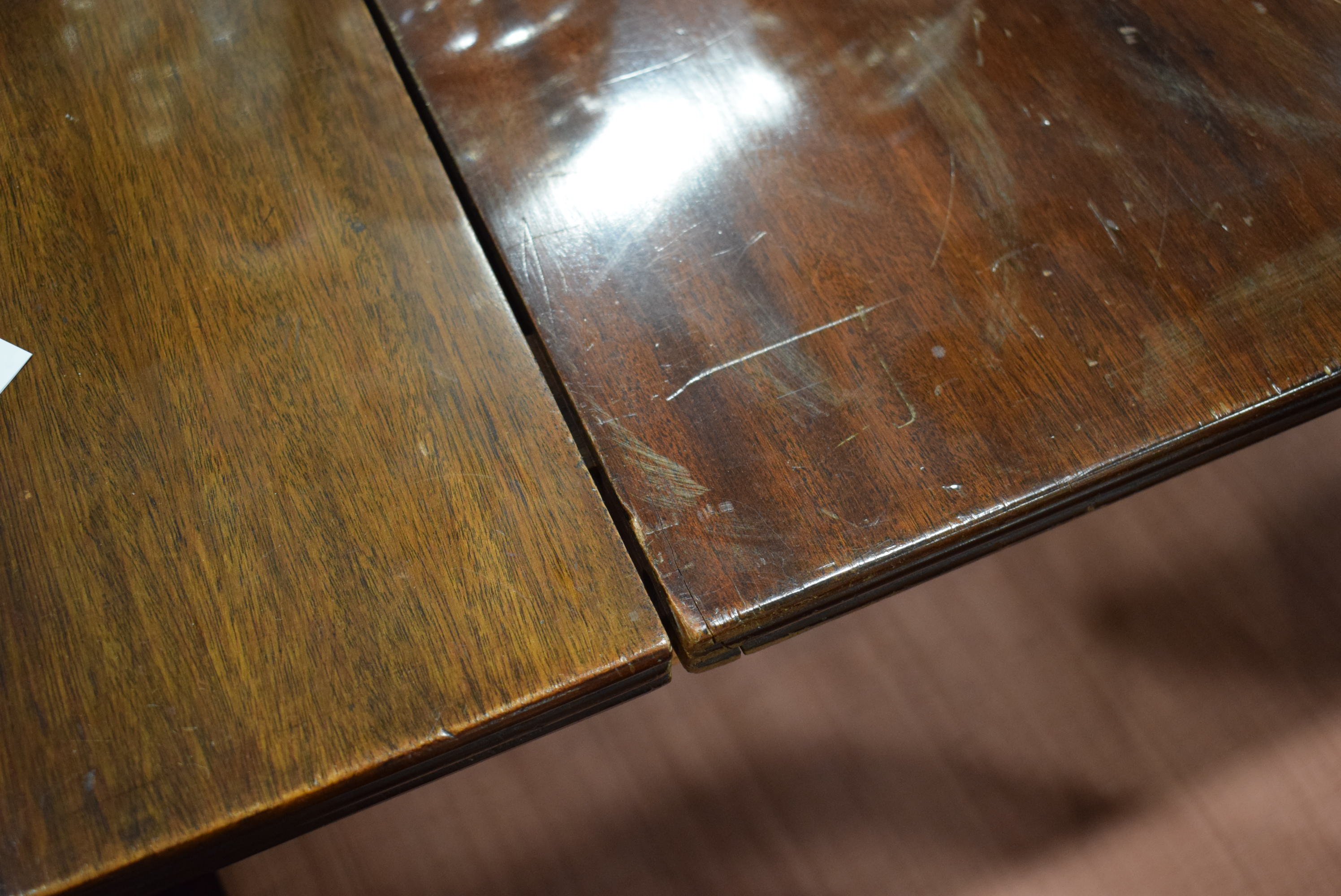 An early 20th century mahogany oval dining table on three columnar pedestals with reeded legs and - Image 12 of 12