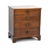 A Georgian mahogany commode, the front with four faux drawers,