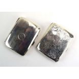 Two early 20th century silver cigarette cases of cushioned rectangular form,