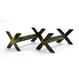 A pair of metalware mounted green hardstone knife rests with x-shaped ends, w. 7.