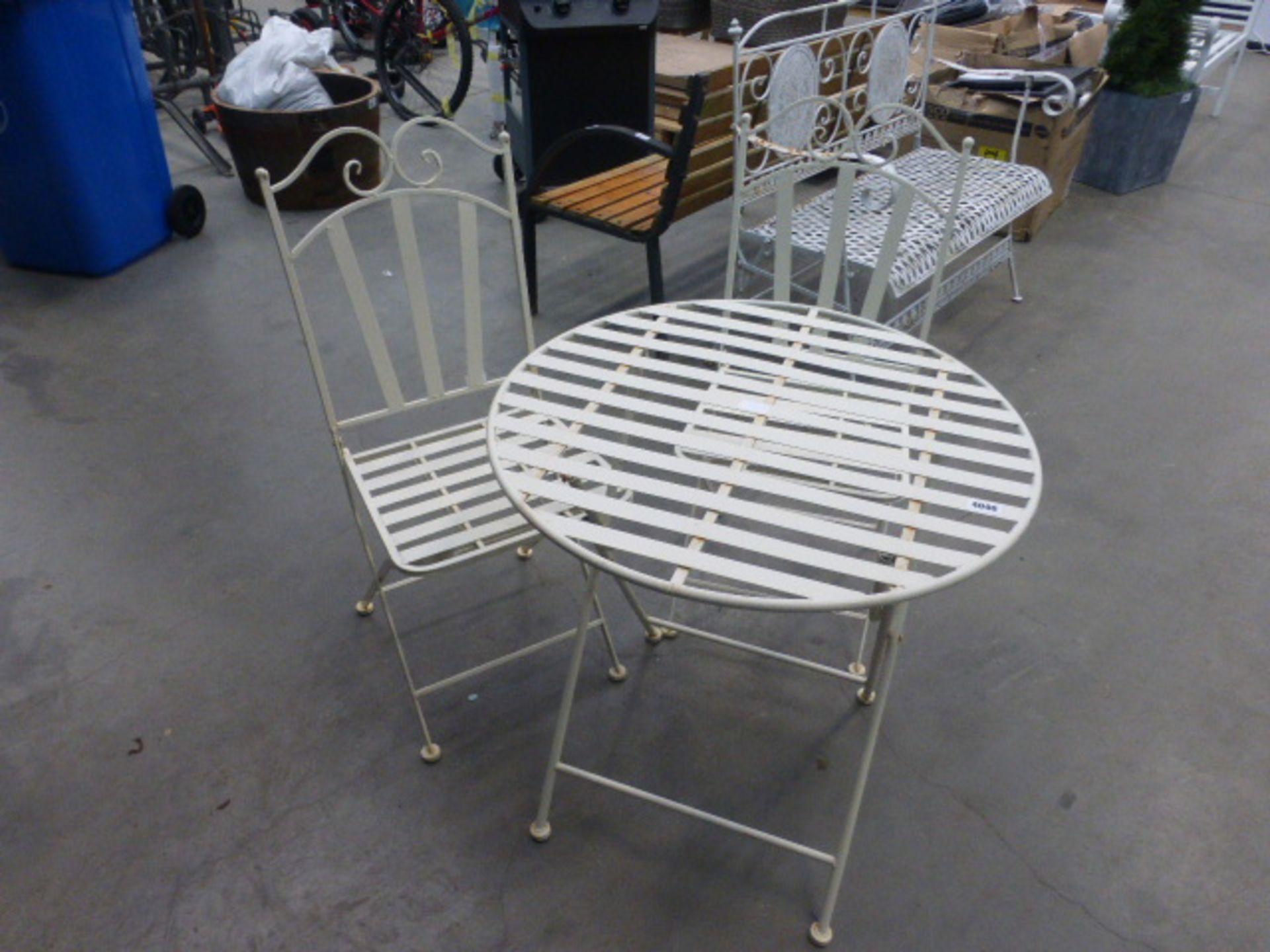 Cream metal folding garden table and 2 matching chairs