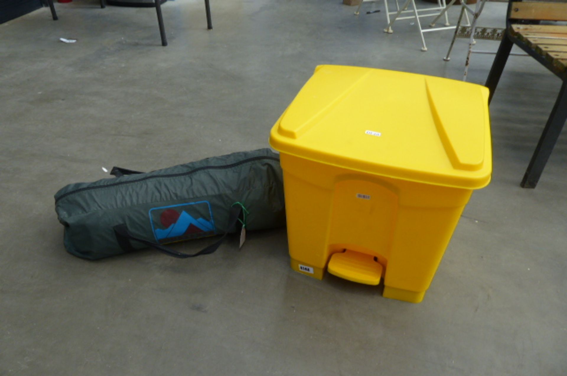 Small 2 person tent and a yellow plastic bin