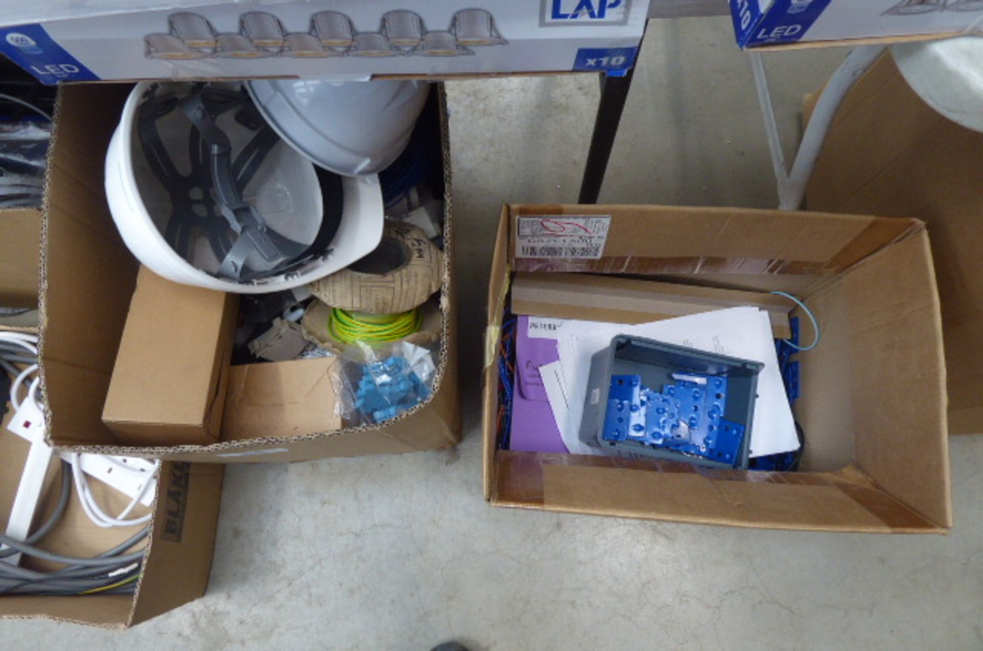 4 boxes containing hard hats, cable, extension cables, switches, etc - Image 2 of 3