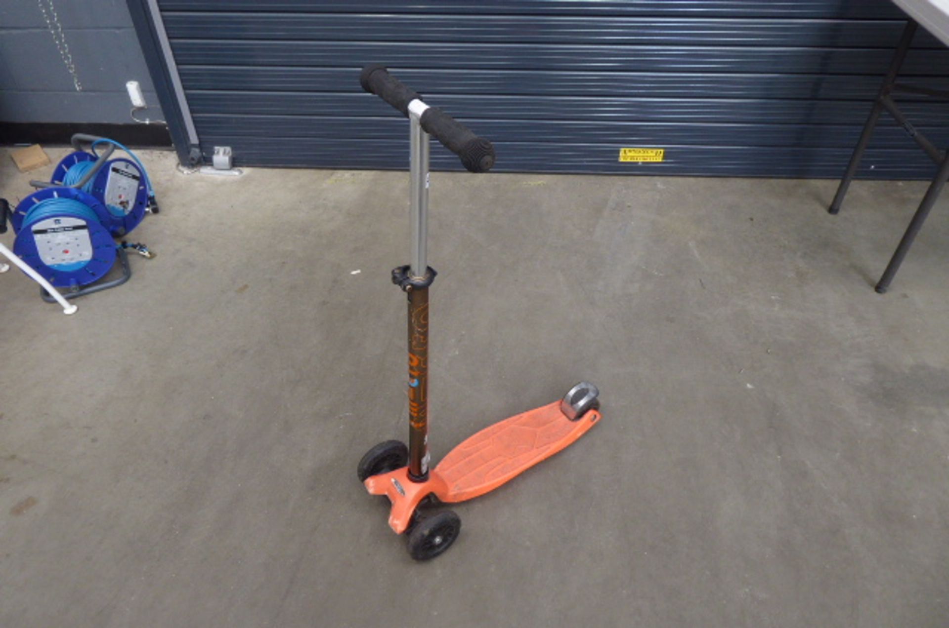 3 wheel orange scooter