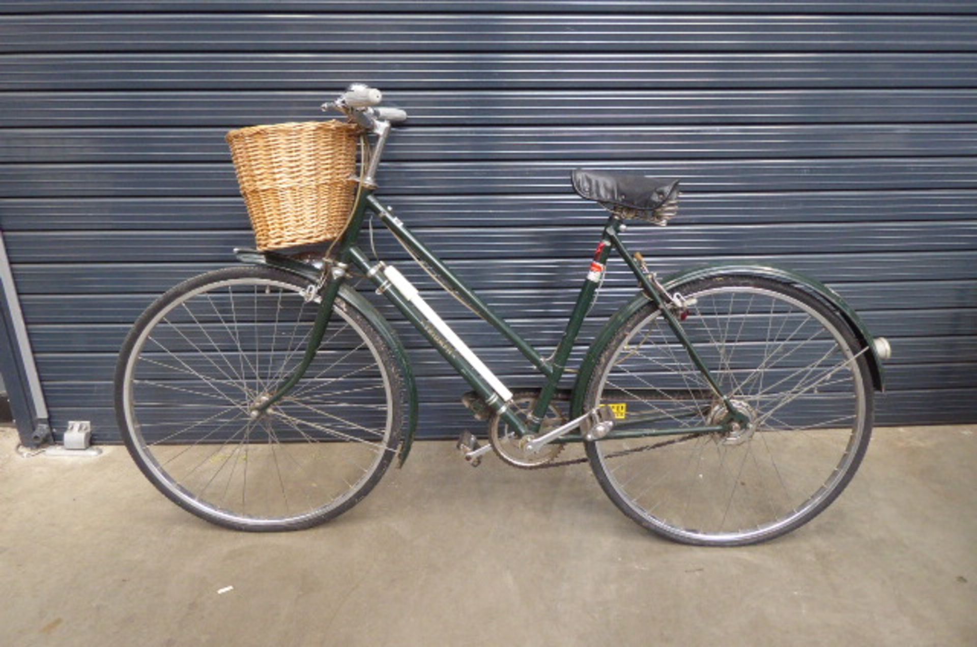 Triumph green vintage ladies bike with front basket