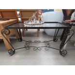 Glass coffee table with wrought iron base