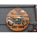 Circualr wooden plaque with painted Kawasaki motorbike motif