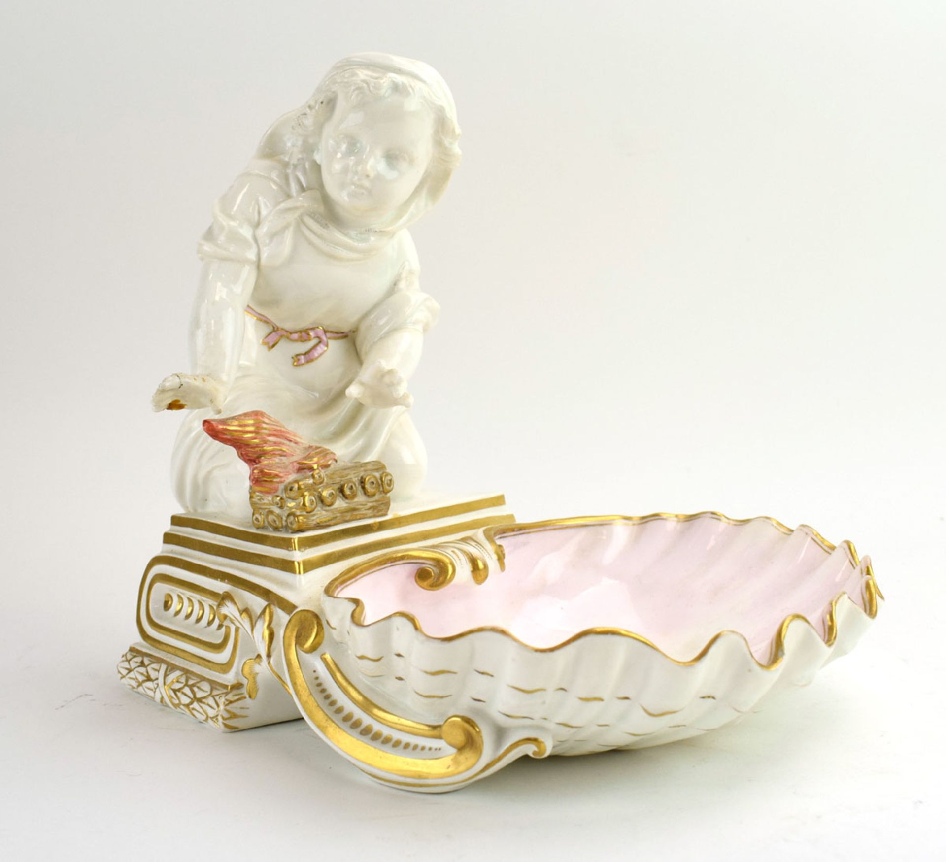 RR365 - A Copeland blanc de chine and gilt decorated shell shaped dish modelled as a child warming