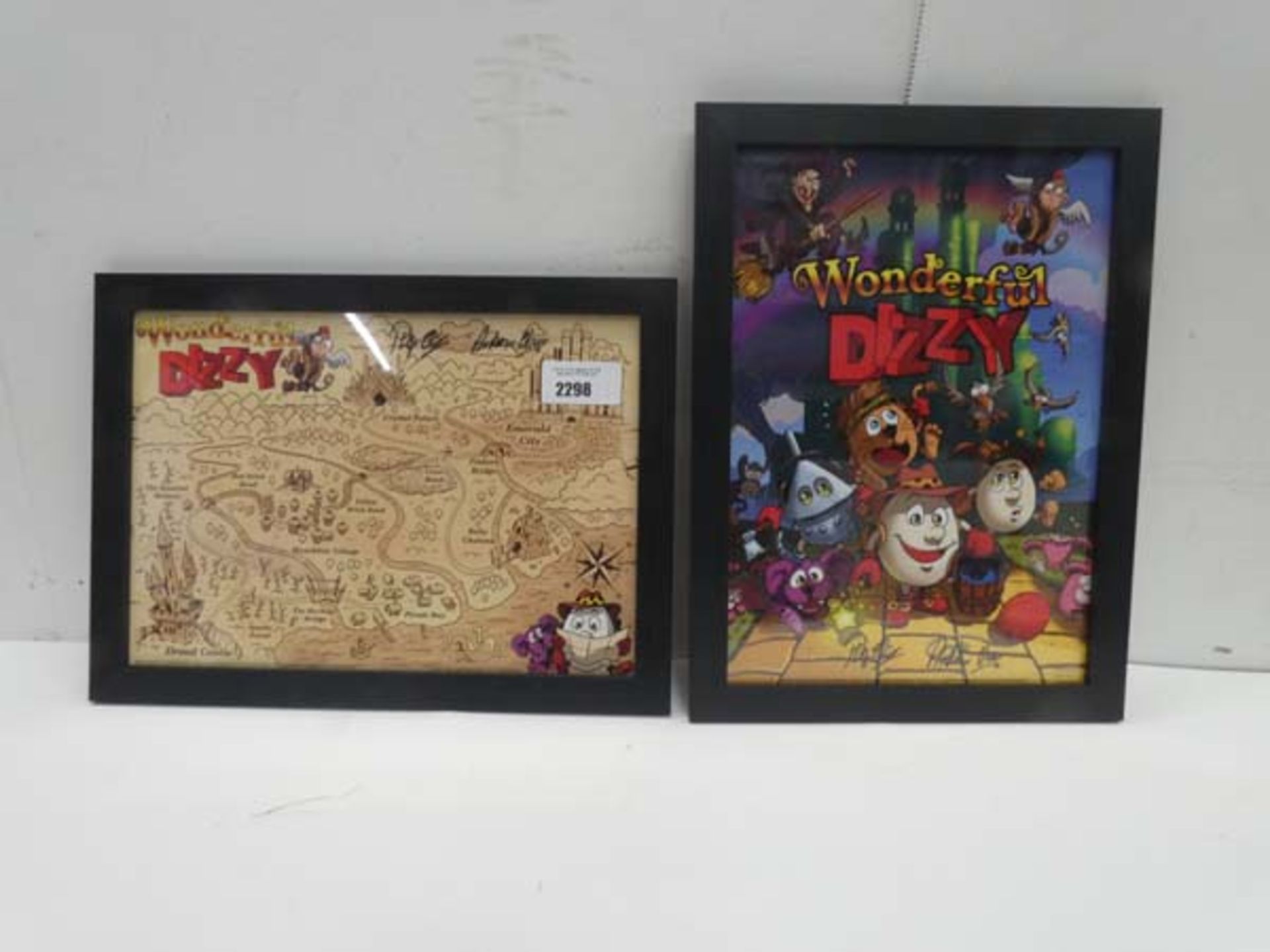Framed 'Wonderful Dizzy' game poster and map, both bearing signatures (*UNVERIFIED*)