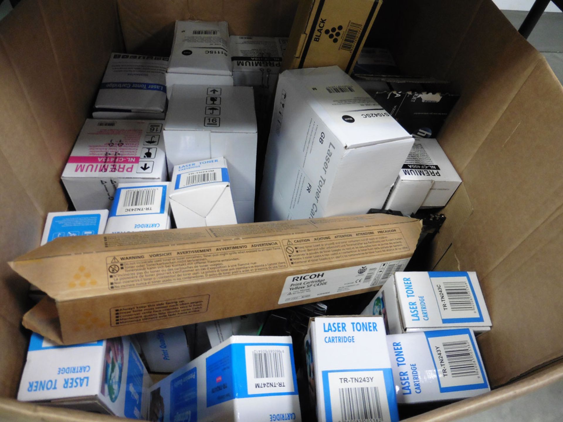 Box containing wide selection of various replacement laser tone cartridges