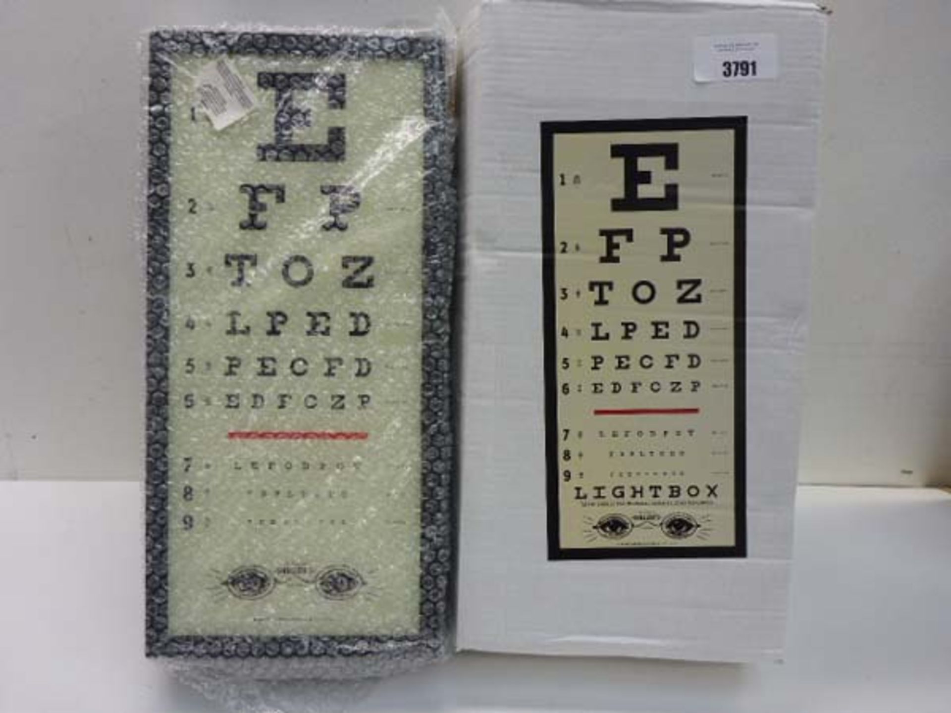 Illuminated eye test light box