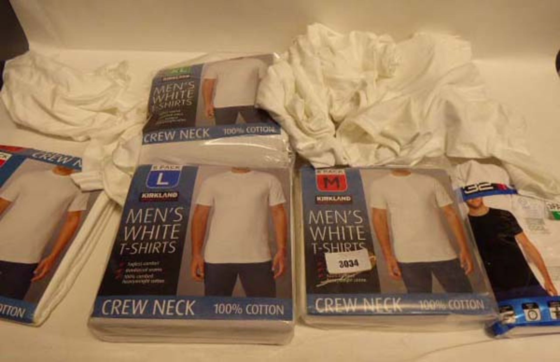 Selection of various mens white t-shirts