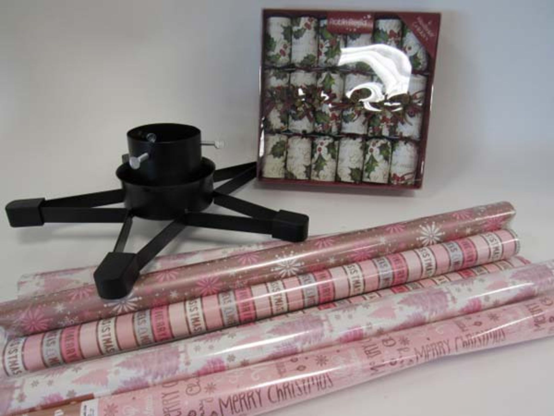 Christmas wrapping paper, Christmas crackers, and Christmas tree stand