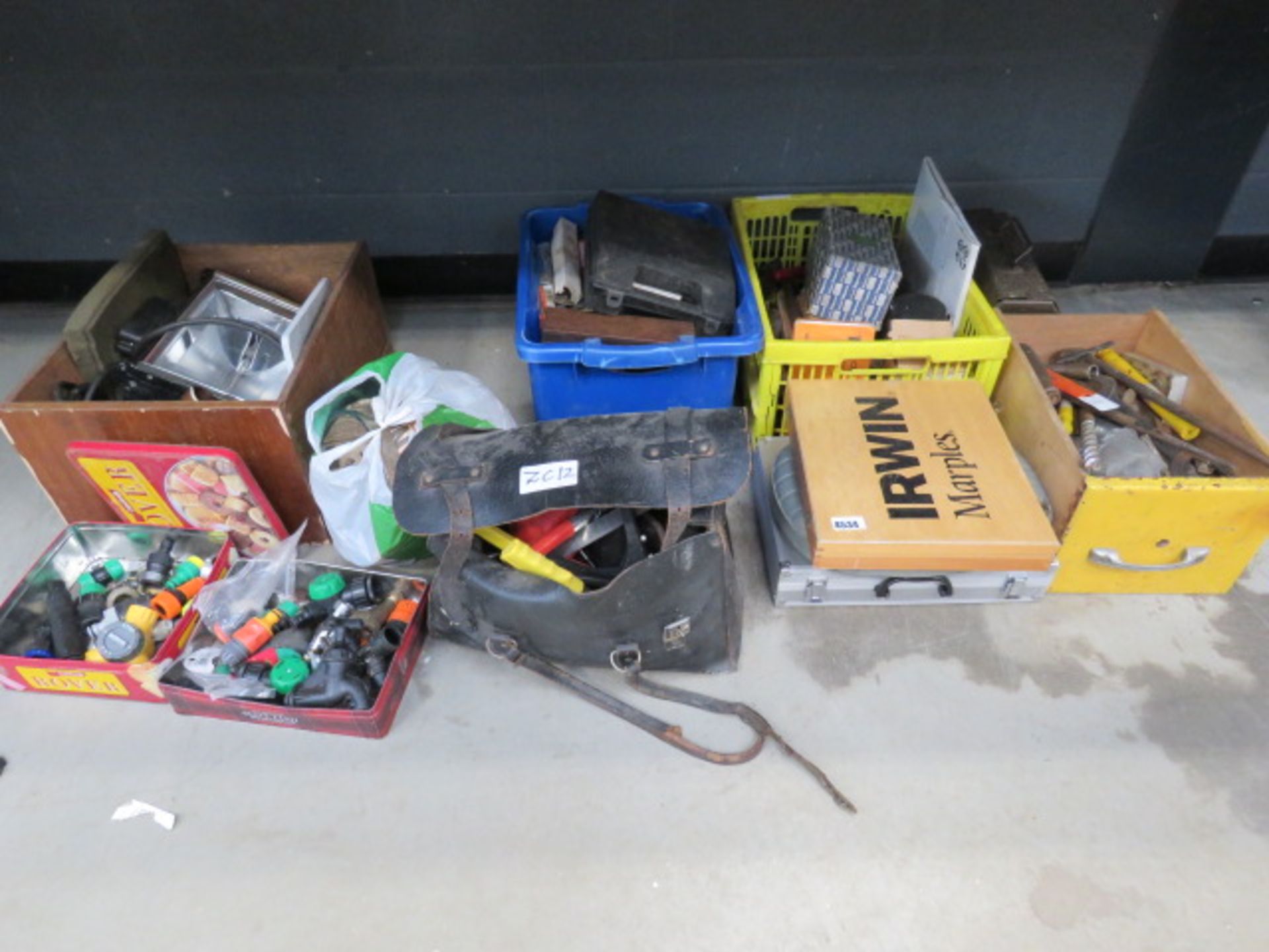 3/4 of an underbay of items to inc. Halogen lights, toolbag containing grease gun, pot riviters,