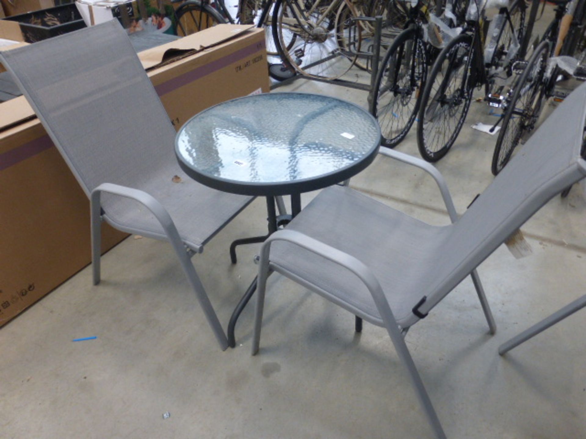 Round glass top patio table and 2 chairs