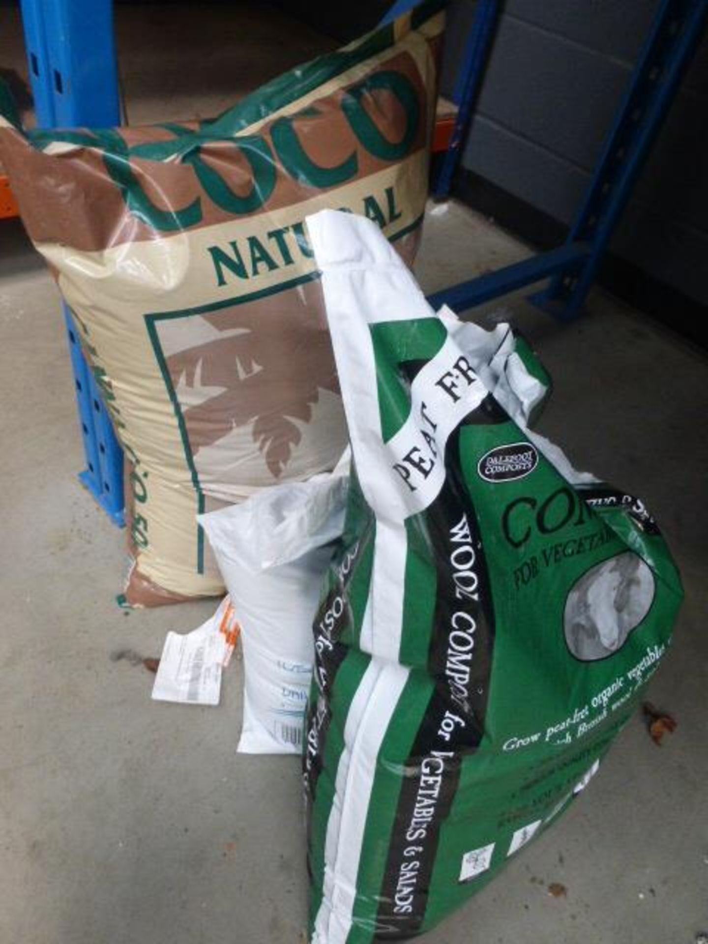 Bag of compost, bag of rock salt and a bag of natural cocoa