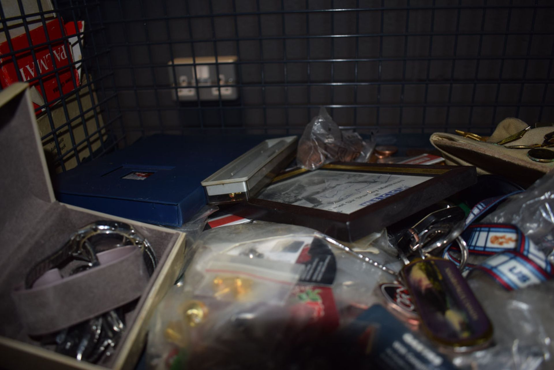 Cage containing wristwatches, loose coinage plus a quantity of badges and medallions - Image 2 of 4