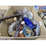 Box containing a dark oak barley twist candlestick, small ship in a bottle, collectors plates,