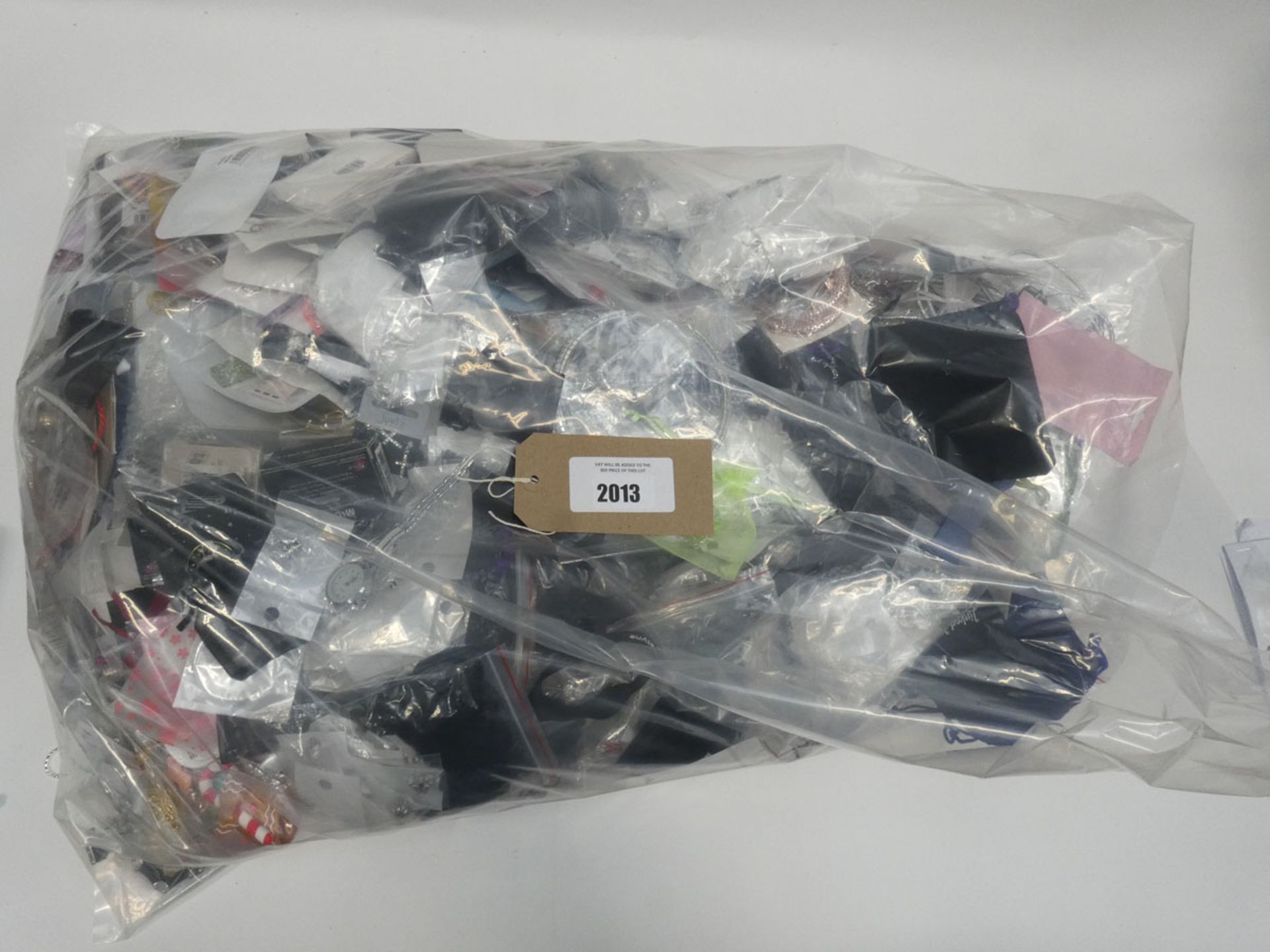 Bag containing quantity of loose costume and dress jewellery