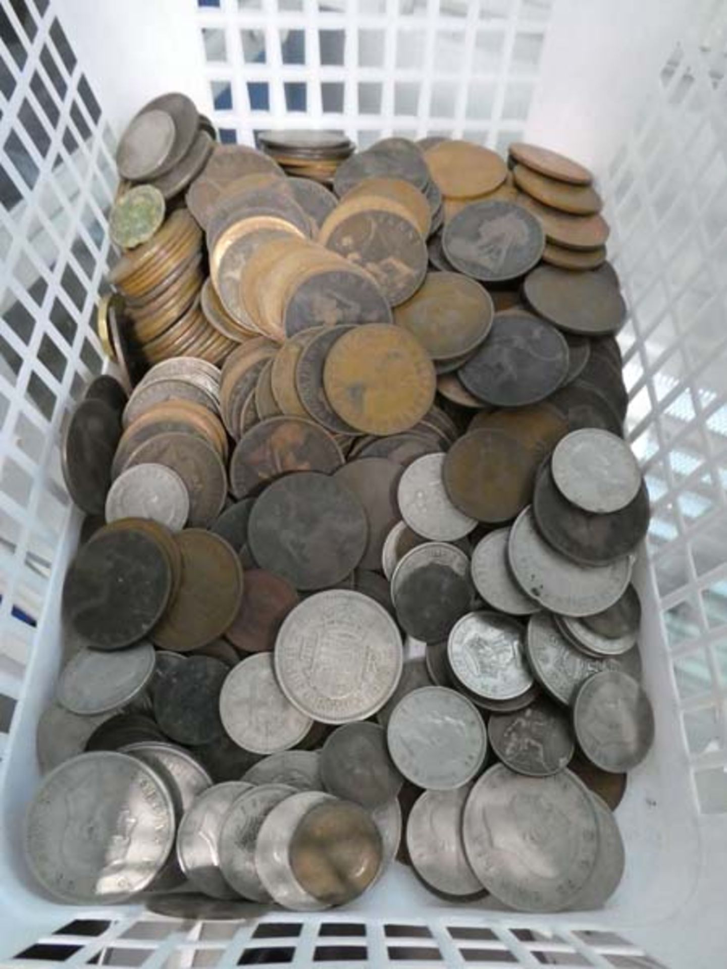 Basket containing a selection of British early coinage to include coppers, half crowns, shillings,