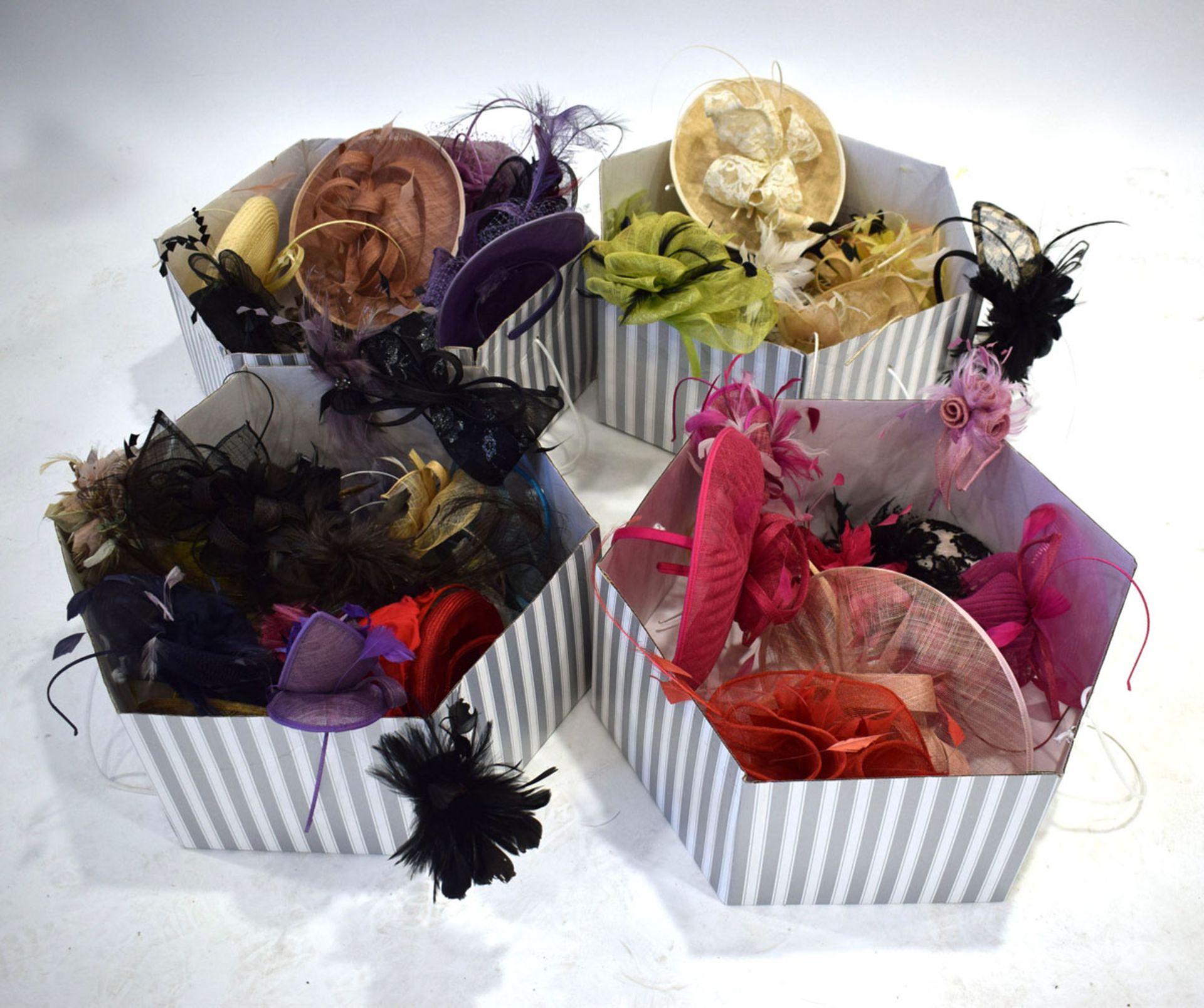 4 boxes of various fascinators in various colours and designs